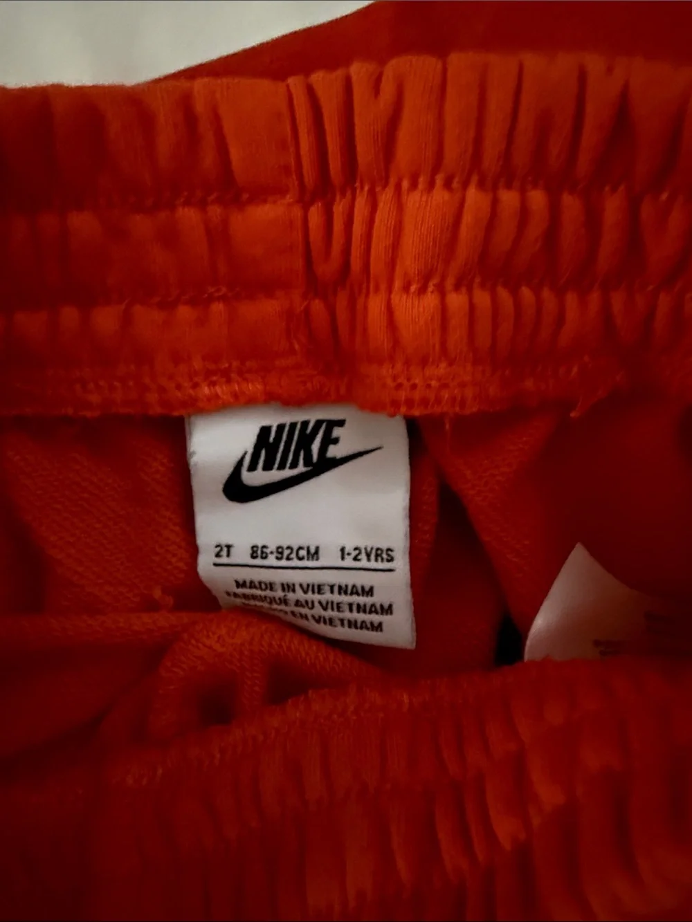 Nike Orange Kids Two-Piece Tee & Shorts Set with White Swoosh